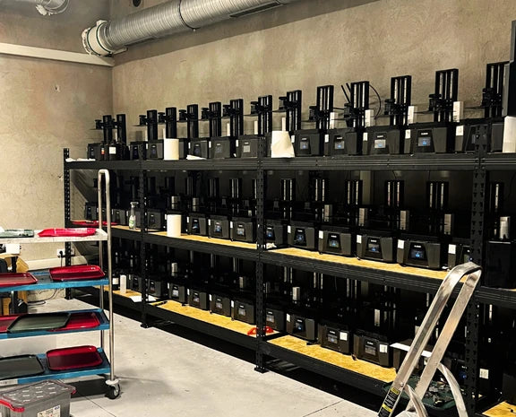 RPG Guild 3D printing farm - rows of resin printers in the Guild workshop