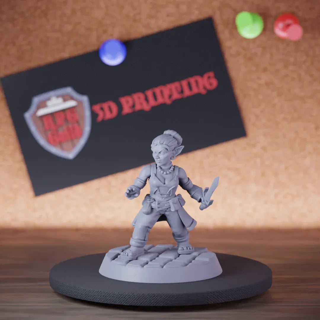 Highly detailed female rogue goblin miniature of FGoblinDagger, perfect for DnD 5e encounters, fantasy tabletop RPG campaigns, painting and display.