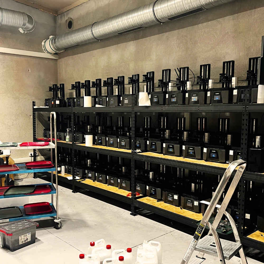 RPG Guild 3D printing farm - rows of resin printers in the Guild workshop